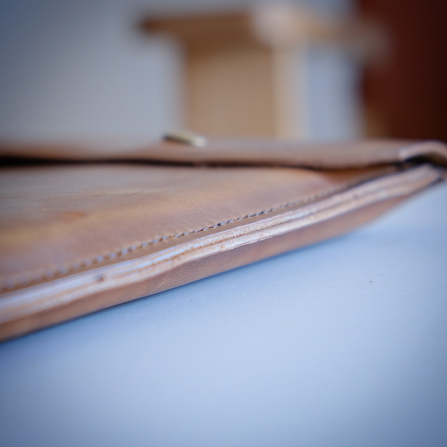 Hand stitched leather edge detail